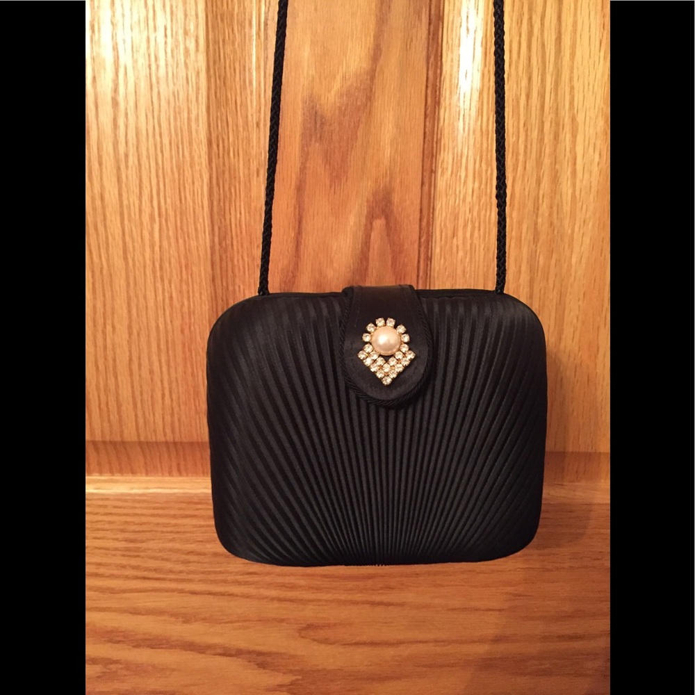 Structured fancy black evening bag with pearl